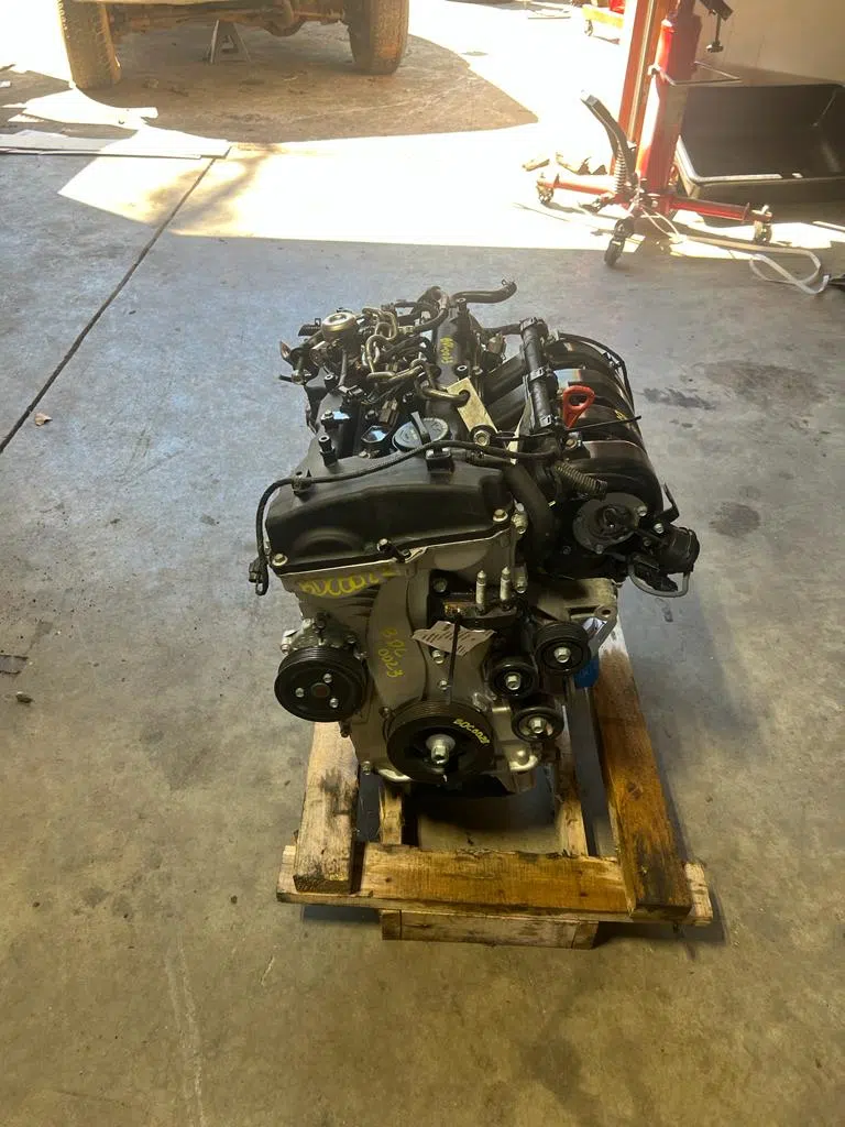 Rebuilt engine on a pallet inside the garage — PIQUET AUTO SERVICE in Greenville