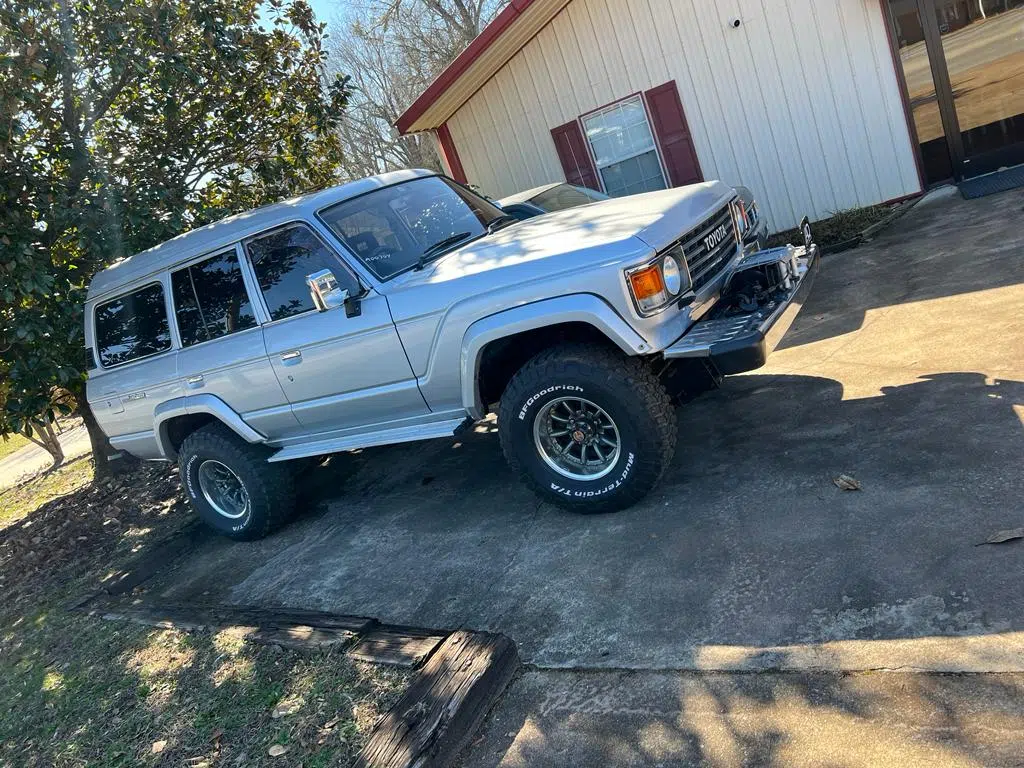 Finished silver Land Cruiser with new tires parked outside — PIQUET AUTO SERVICE in Greenville